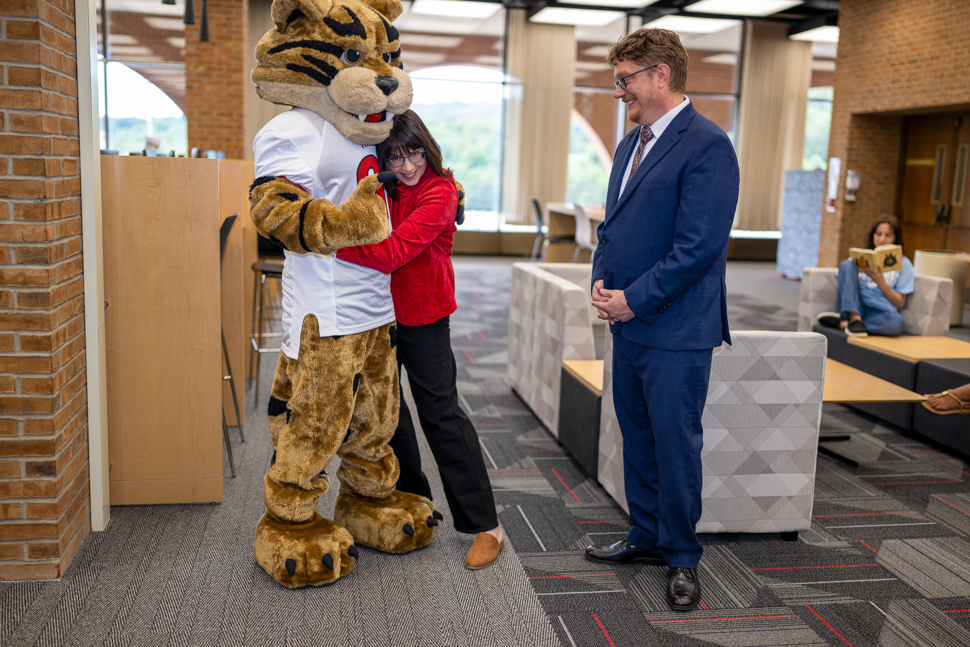 Jennifer hugs Bob E. Cat in the Ort Library